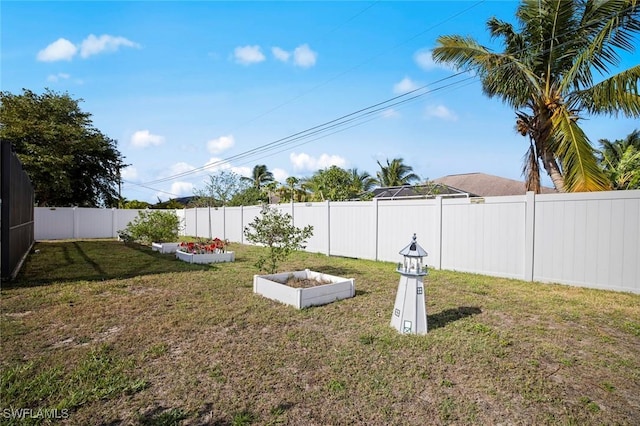 4116 SW 15th Ave, Cape Coral, FL 33914 - view of yard with a fenced backyard and a vegetable garden