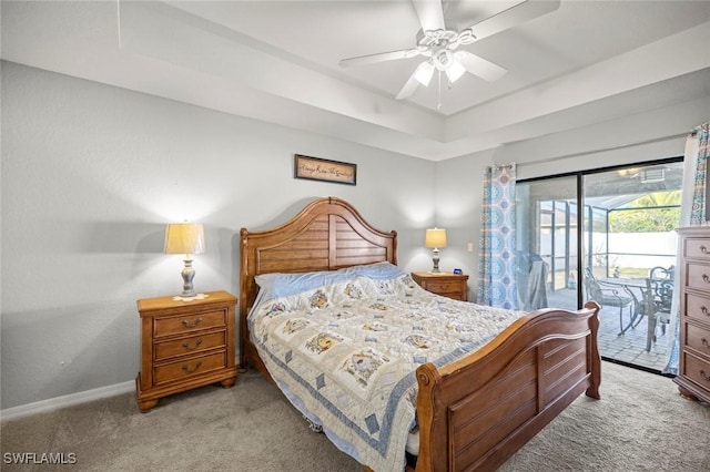 4116 SW 15th Ave, Cape Coral, FL 33914 - bedroom featuring a raised ceiling, baseboards, access to outside, and carpet