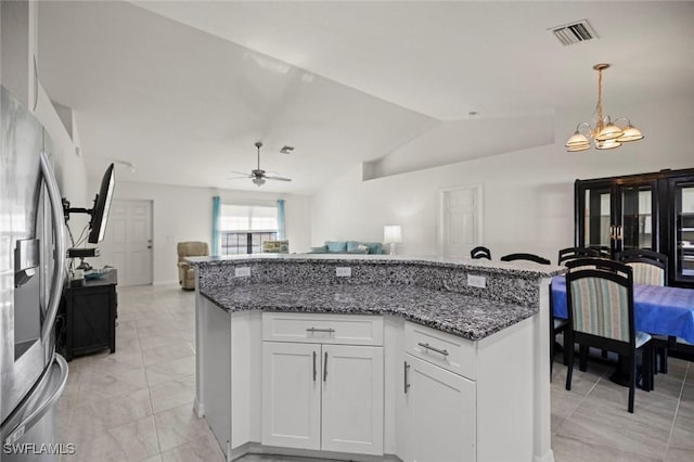 4116 SW 15th Ave, Cape Coral, FL 33914 - kitchen with lofted ceiling, visible vents, stainless steel refrigerator with ice dispenser, and open floor plan
