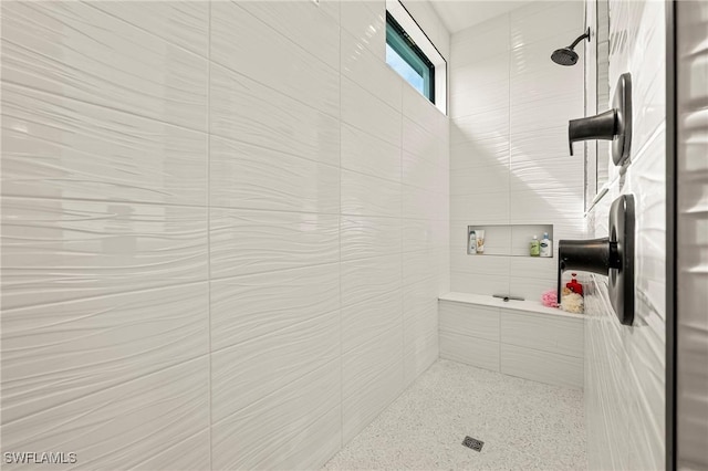 full bath with a tile shower