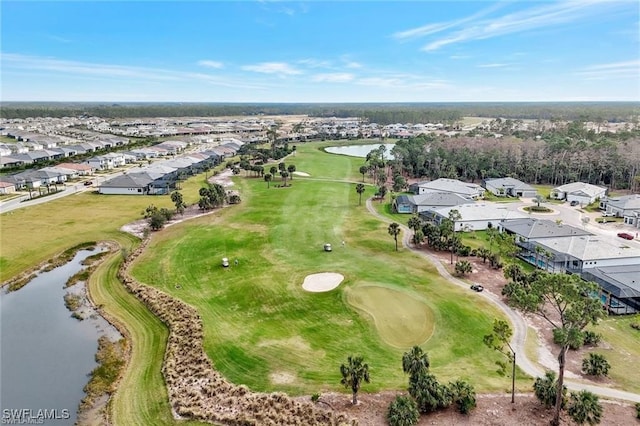 bird's eye view featuring a water view, golf course view, and a residential view