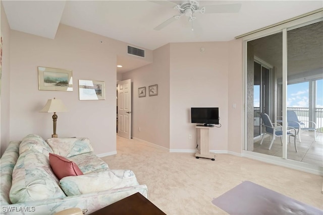 living room featuring carpet, visible vents, baseboards, and ceiling fan