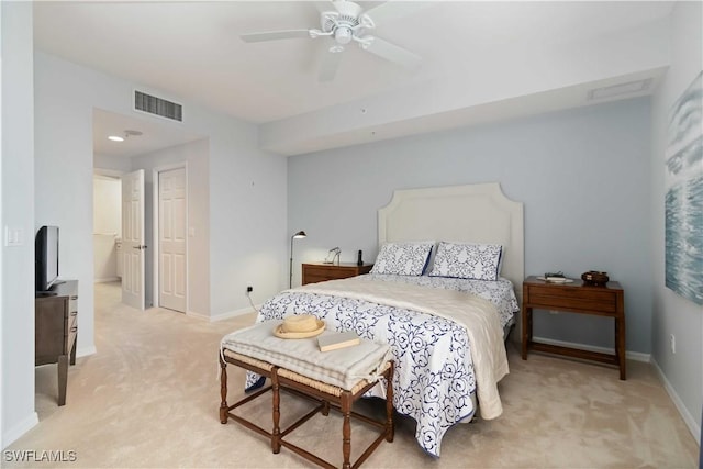 bedroom featuring light carpet, visible vents, and baseboards