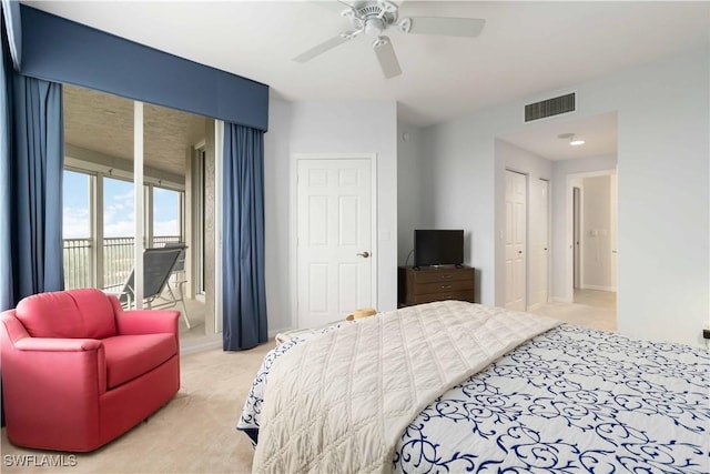 bedroom featuring visible vents, access to exterior, a ceiling fan, and carpet floors