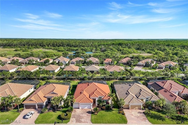 9282 Quarry Dr, Naples, FL 34120 - drone / aerial view featuring a residential view and a forest view