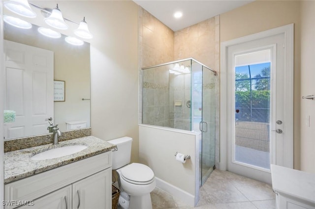 9282 Quarry Dr, Naples, FL 34120 - full bath with a shower stall, vanity, tile patterned flooring, and toilet