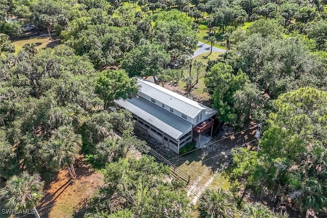 bird's eye view featuring a wooded view