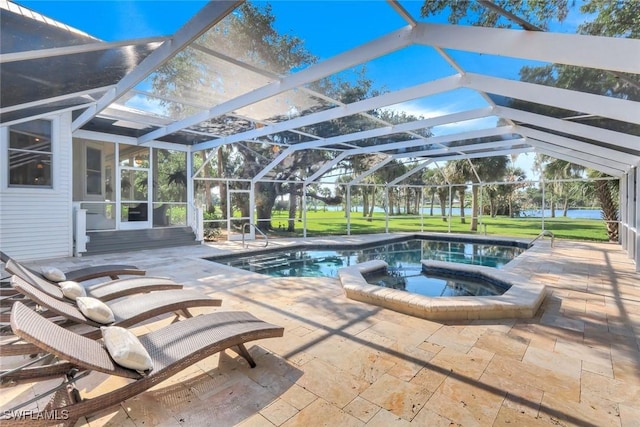 pool featuring a patio area, glass enclosure, and an in ground hot tub