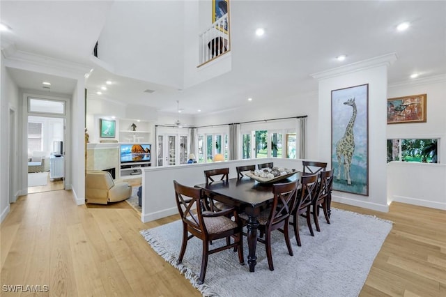 dining room featuring recessed lighting, ornamental molding, and a healthy amount of sunlight