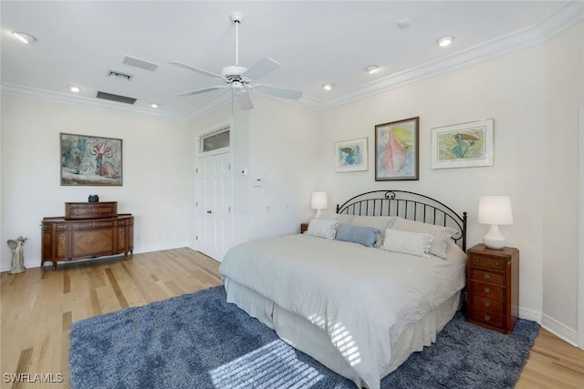 bedroom with baseboards, visible vents, recessed lighting, wood finished floors, and ornamental molding