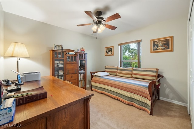 bedroom featuring carpet floors, baseboards, and ceiling fan
