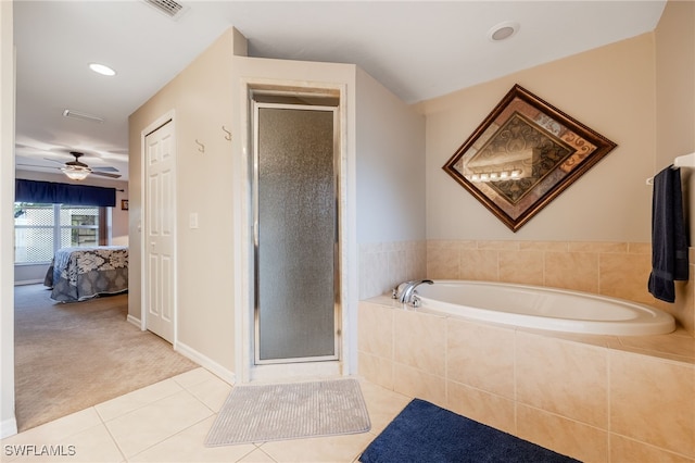 ensuite bathroom featuring a stall shower, a bath, tile patterned flooring, and ensuite bath