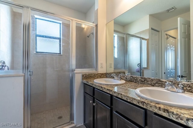 5467 Ferris Ave, Ave Maria, FL 34142 - full bathroom featuring a stall shower and double vanity