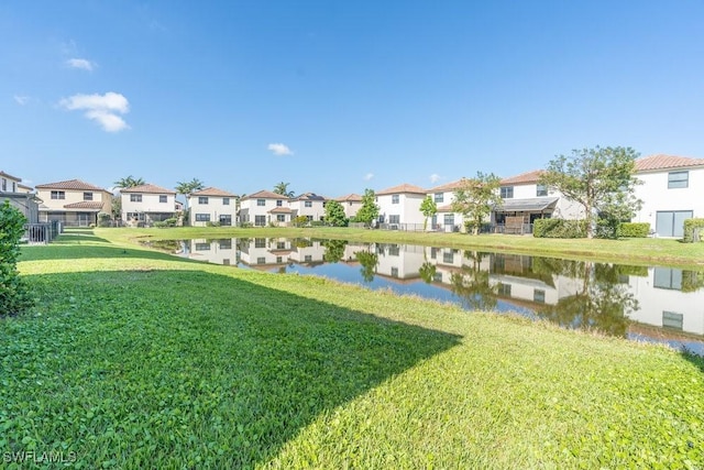 5467 Ferris Ave, Ave Maria, FL 34142 - view of green lawn with a residential view and a water view