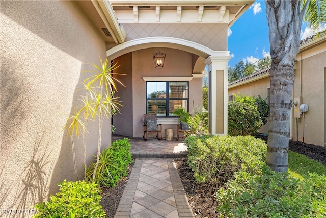 4194 Aspen Chase Dr, Naples, FL 34119 - view of exterior entry with stucco siding
