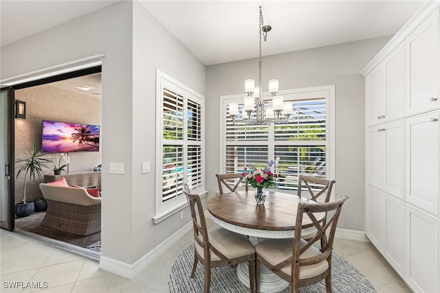 4194 Aspen Chase Dr, Naples, FL 34119 - dining room with a chandelier, healthy amount of natural light, and light tile patterned flooring