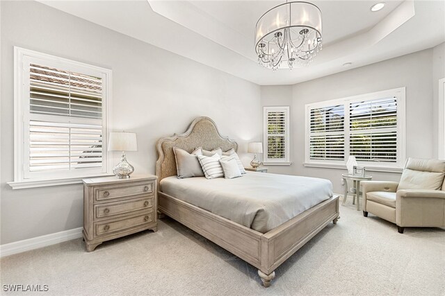 4194 Aspen Chase Dr, Naples, FL 34119 - bedroom with a chandelier, light carpet, a raised ceiling, and recessed lighting