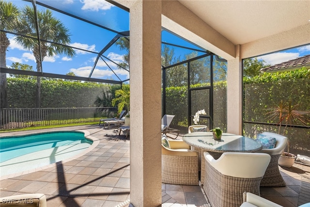 4194 Aspen Chase Dr, Naples, FL 34119 - view of swimming pool featuring a patio area, glass enclosure, and outdoor dining area