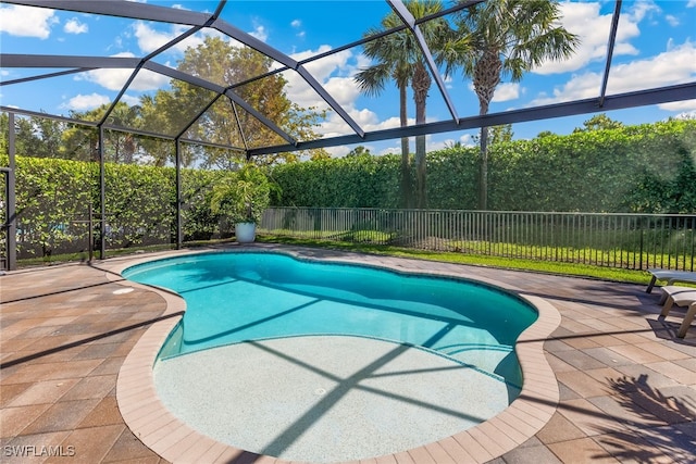 4194 Aspen Chase Dr, Naples, FL 34119 - view of pool featuring a patio area, a fenced backyard, and glass enclosure
