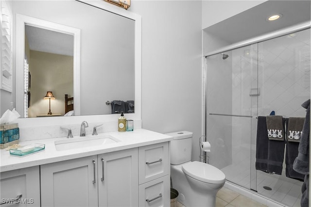 3370 Oaklake Ct, Bonita Springs, FL 34134 - bathroom featuring vanity, a stall shower, recessed lighting, tile patterned flooring, and toilet