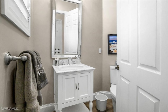 3370 Oaklake Ct, Bonita Springs, FL 34134 - bathroom with toilet, vanity, and baseboards