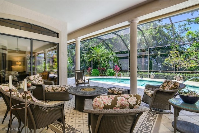 3370 Oaklake Ct, Bonita Springs, FL 34134 - view of patio / terrace with an outdoor pool, glass enclosure, and a fire pit
