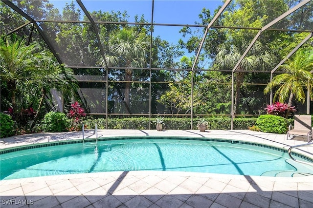 3370 Oaklake Ct, Bonita Springs, FL 34134 - outdoor pool with glass enclosure and a patio