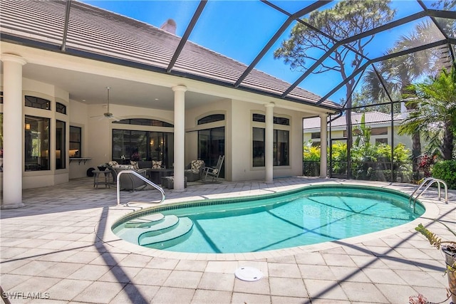 3370 Oaklake Ct, Bonita Springs, FL 34134 - outdoor pool with a patio area, glass enclosure, and ceiling fan