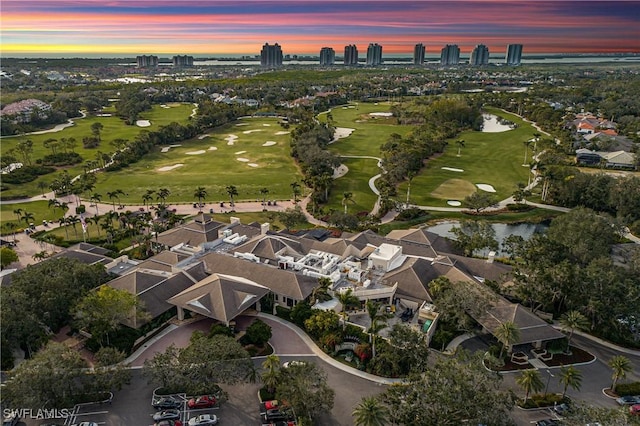 3370 Oaklake Ct, Bonita Springs, FL 34134 - aerial view at dusk with a residential view, view of golf course, and a water view