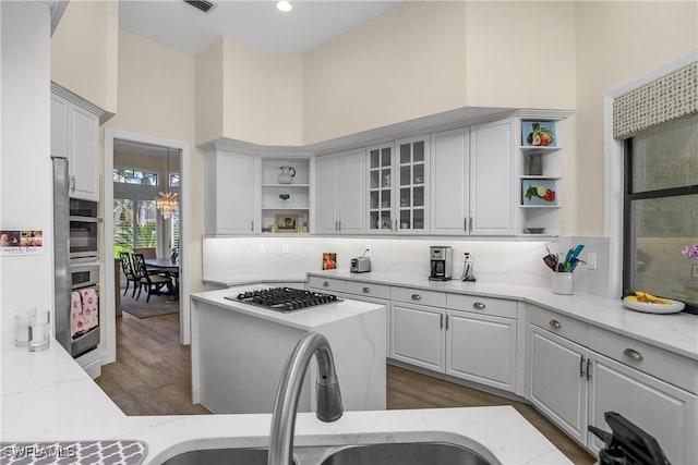 3370 Oaklake Ct, Bonita Springs, FL 34134 - kitchen featuring stainless steel appliances, dark wood-style floors, white cabinetry, and open shelves