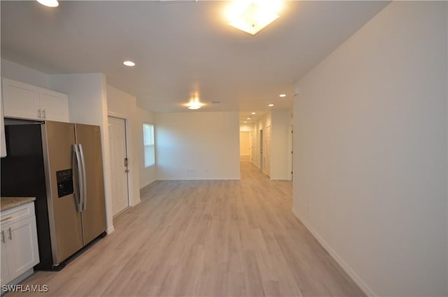 3341 Willard St, Fort Myers, FL 33916 - kitchen featuring white cabinets, light wood finished floors, baseboards, recessed lighting, and stainless steel fridge with ice dispenser