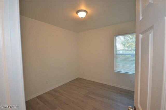 3341 Willard St, Fort Myers, FL 33916 - empty room with baseboards and wood finished floors