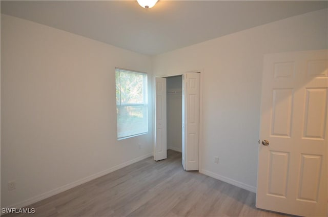 3341 Willard St, Fort Myers, FL 33916 - unfurnished bedroom with a closet, baseboards, and light wood finished floors
