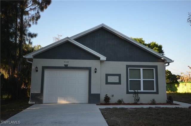 3341 Willard St, Fort Myers, FL 33916 - ranch-style home with stucco siding, a garage, and concrete driveway