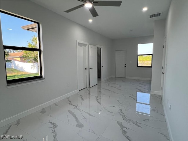 unfurnished bedroom featuring recessed lighting, baseboards, marble finish floor, and visible vents