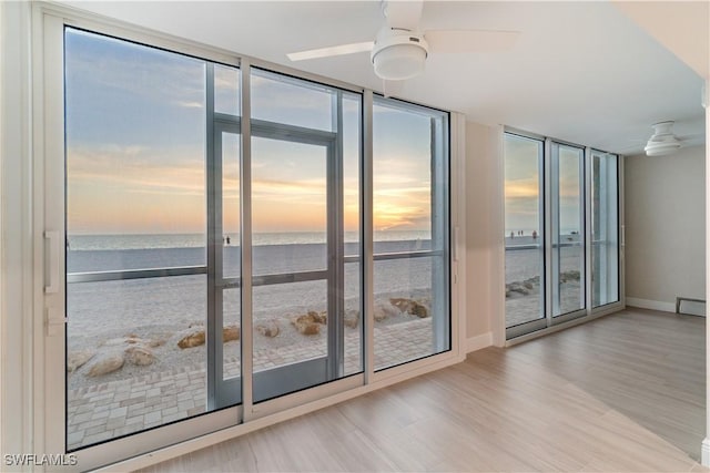 25900 Hickory Blvd Unit 101, Bonita Springs, FL 34134 - doorway with a ceiling fan, a wealth of natural light, and a water view