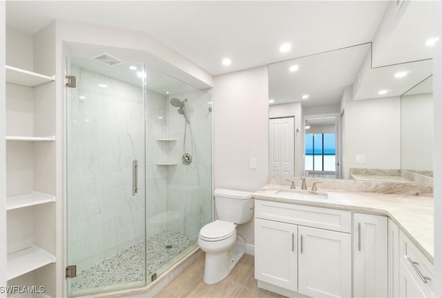 25900 Hickory Blvd Unit 101, Bonita Springs, FL 34134 - full bath featuring wood finished floors, visible vents, toilet, and a marble finish shower