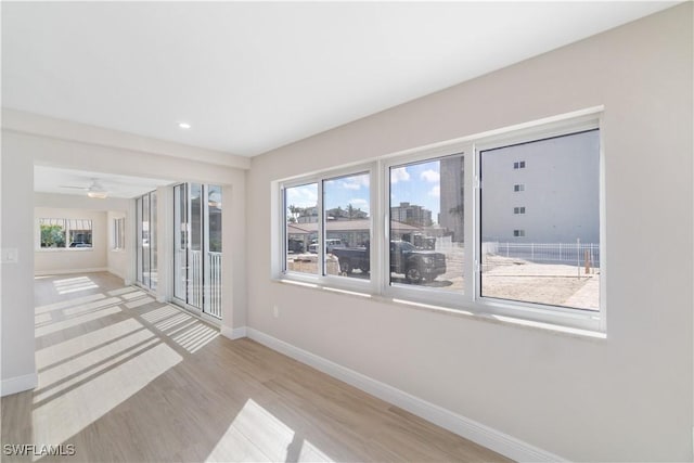 25900 Hickory Blvd Unit 101, Bonita Springs, FL 34134 - spare room featuring ceiling fan, baseboards, wood finished floors, and recessed lighting