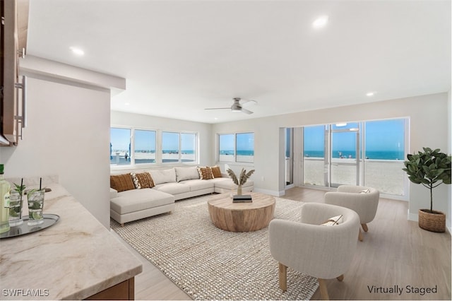 25900 Hickory Blvd Unit 101, Bonita Springs, FL 34134 - living area with ceiling fan, a water view, light wood finished floors, and recessed lighting