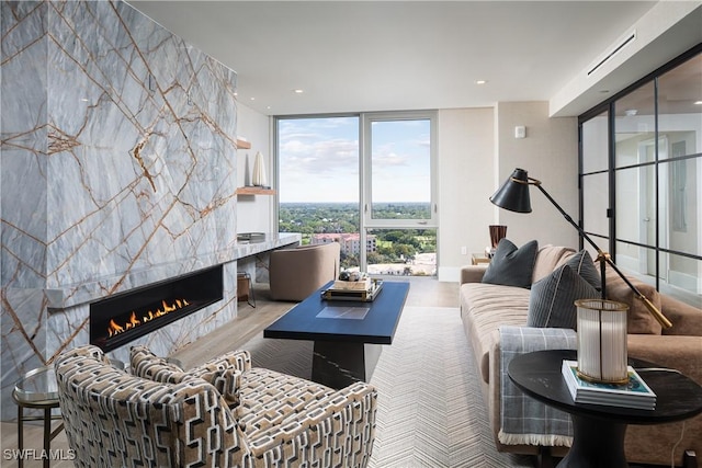 6897 Grenadier Blvd Unit 1602, Naples, FL 34108 - living area with a tiled fireplace and floor to ceiling windows