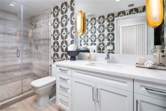 6897 Grenadier Blvd Unit 1602, Naples, FL 34108 - bathroom featuring vanity, a stall shower, toilet, and wood finished floors