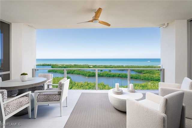6897 Grenadier Blvd Unit 1602, Naples, FL 34108 - balcony featuring a water view, ceiling fan, and an outdoor hangout area