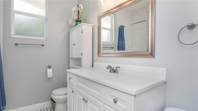 1824 SE 20th Ln, Cape Coral, FL 33990 - bathroom with toilet, a wealth of natural light, baseboards, and vanity