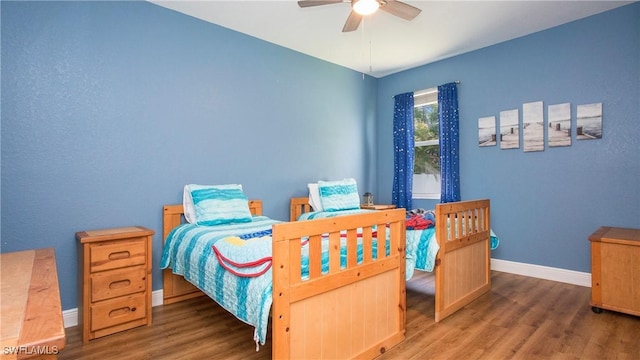 1824 SE 20th Ln, Cape Coral, FL 33990 - bedroom with ceiling fan, baseboards, and wood finished floors