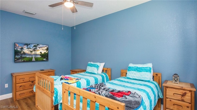 1824 SE 20th Ln, Cape Coral, FL 33990 - bedroom with a ceiling fan, visible vents, wood finished floors, and baseboards