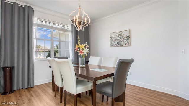 1824 SE 20th Ln, Cape Coral, FL 33990 - dining space with crown molding, light wood-type flooring, baseboards, and a notable chandelier