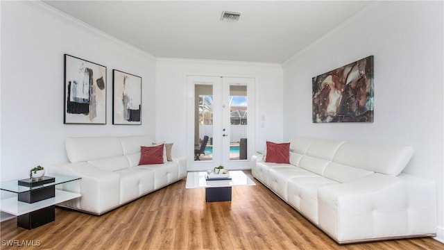 1824 SE 20th Ln, Cape Coral, FL 33990 - living area featuring crown molding, wood finished floors, visible vents, and french doors