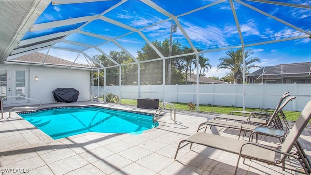 1824 SE 20th Ln, Cape Coral, FL 33990 - view of swimming pool featuring a patio area, french doors, a fenced in pool, and a fenced backyard