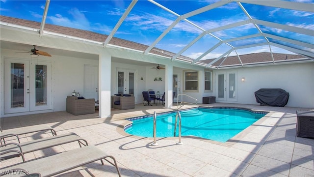 1824 SE 20th Ln, Cape Coral, FL 33990 - outdoor pool featuring a patio area, french doors, a ceiling fan, and glass enclosure