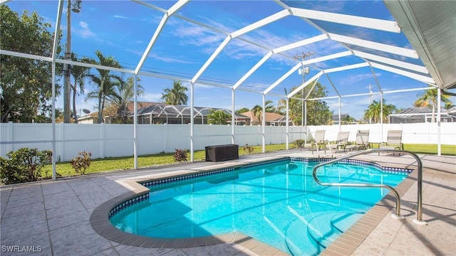 1824 SE 20th Ln, Cape Coral, FL 33990 - view of pool featuring a patio area, glass enclosure, a fenced in pool, and a fenced backyard